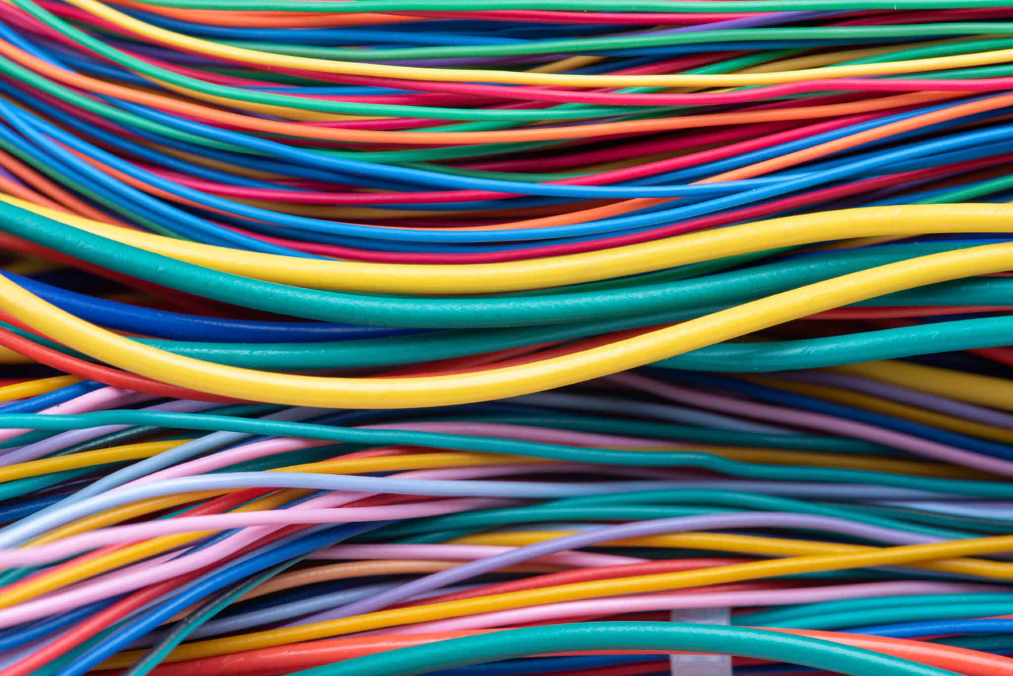 Multicolored electrical computer cables in a group.