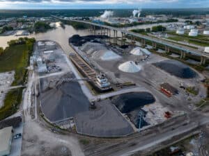 Aerial Shot of GLC Minerals plant with ship in cargo port unloading.